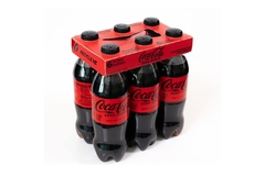 Image Coca-Cola bottles in paperboard multipack carrier.