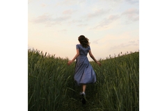 girl in field runs