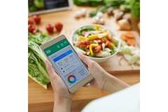 Image Person checking the nutrient and calorie content of a meal.