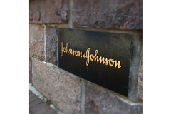 A J&J sign on the side of a building.