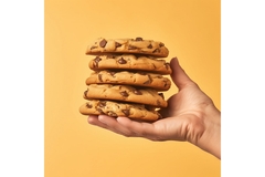A hand holding cookies.