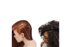 Image The top of two women's heads with dots and lines in their hair.