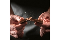 Image Hands breaking chocolate bar.