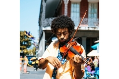 Focused person playing the violin