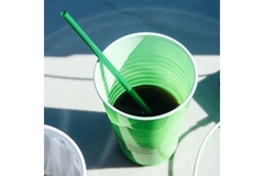 Drinking cup with straw.