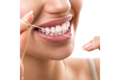Image woman flossing teeth