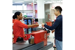 A cashier at Target checking out a customer.