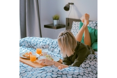 Woman has breakfast in bed