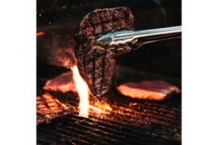 Image Piece of beef on barbecue.