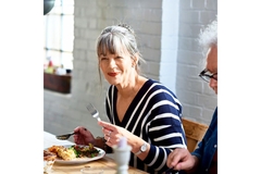 Image Woman eating healthy meal.