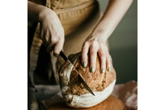 Image Person cutting up whole wheat bread.