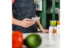 Woman scanning food with an app on her phone.