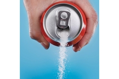 Image Sugar pouring out of a can of soda.