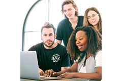 Image Students sitting behind a computer.