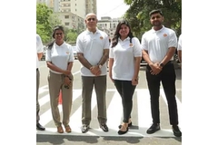 Shell Pakistan employees standing on newly built road.