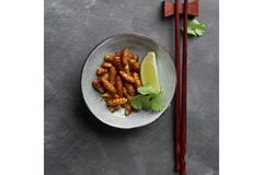 Image fried insects on a white plate.