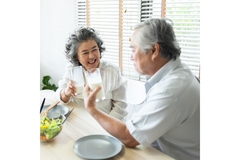 Image Senior Asian couple drinking milk.