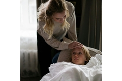 Image Woman comforting a child with the flu.