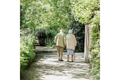 Image Two elderly people taking a walk