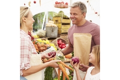 a family buying fruits and vegetables.