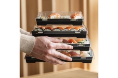 Image sushi in transparent packaging box.