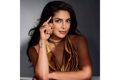 Image Priyanka Chopra holding a foundation from Max Factor up to her face.