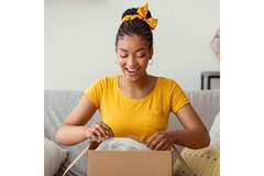 Image Woman opening a parcel.