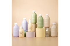 Image A line of Crown Hair Society products on pedestals.
