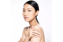 Image woman poses with clear radiant skin