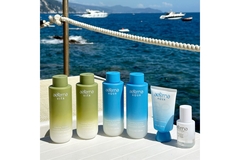 Aeterna hair care products with the ocean in background