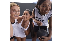 Image Three female athletes smiling and touching their skin.
