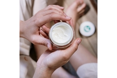 Woman applying skin care