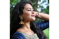An Indian woman posing.