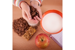 Image Child eating cereal breakfast.