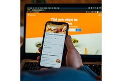 Image A person ordering food online.