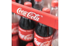 Image A close up of Coca-Cola bottles.