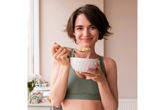Image Woman with a bowl of cereal and milk