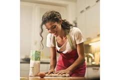 Image Woman baking with cornmeal and corn bran.