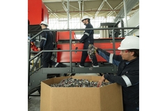 Image Workers in faciliity working with textile waste.