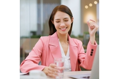 Happy woman taking her supplement