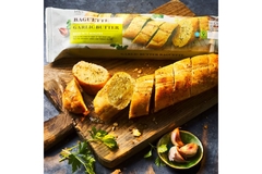 Garlic baguette in paper packaging.