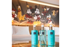 Image Rituals products on a hotel bed.
