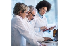 Image Botanical experts analyzing data on ashwagandha.