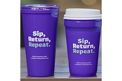 Two cups on a table.