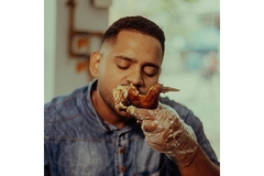 A man eating meat.