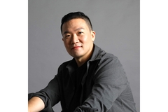 Image a man in a grey shirt.
