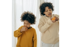 Image Two boys eating oranges