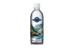 Image A white and blue bottle with a label on it.