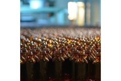 Image A group of brown glass bottles.