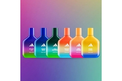Image Bottles of Adidas perfume lined in a row.